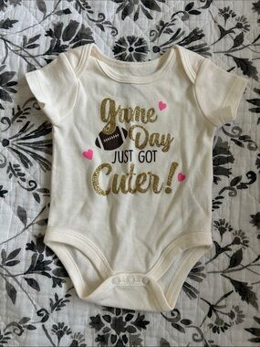 Ivory "Game Day Just Got Cuter" Gold Glitter One-Piece Bodysuit